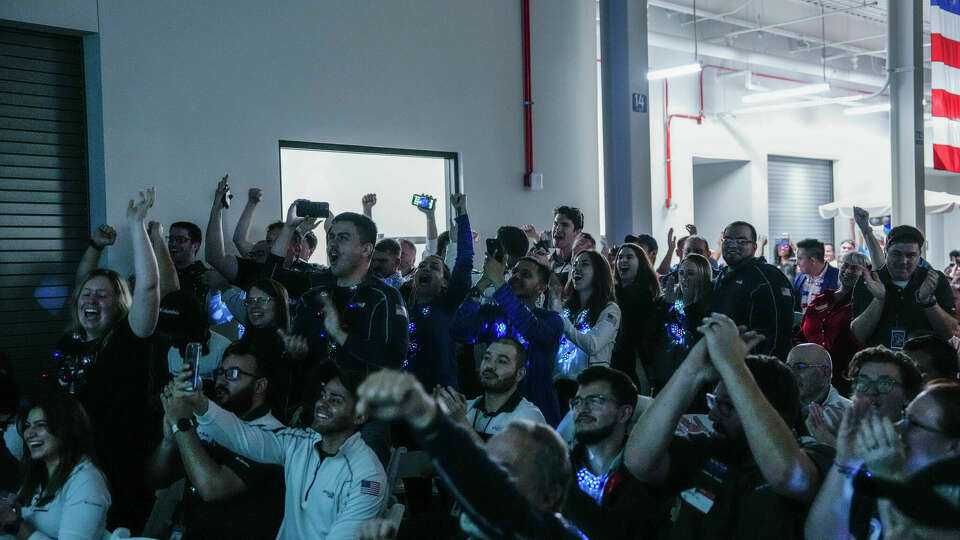 Intuitive Machines employees cheer during a watch party moments after they became the first commercial company to softly land on the moon on Thursday, Feb. 22, 2024, in Houston .