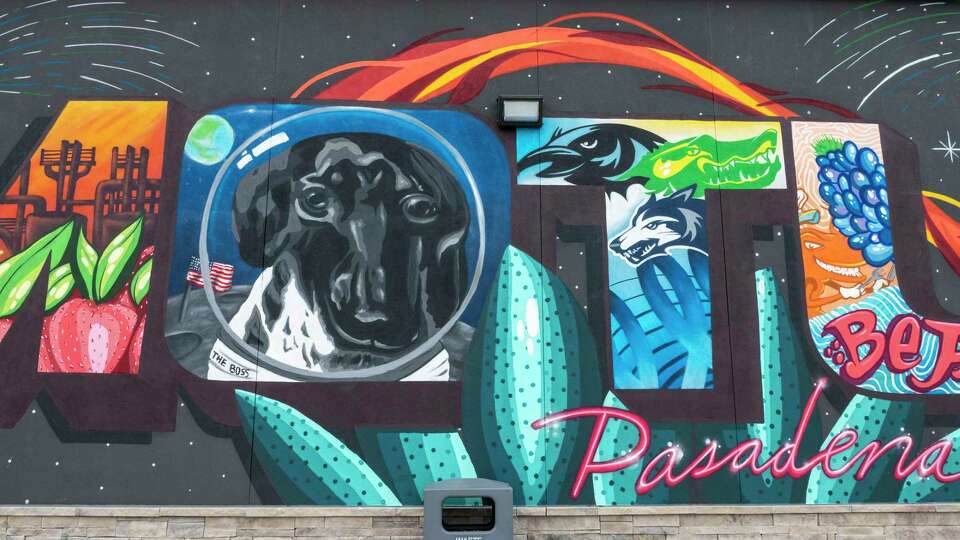 A mural is visible outside the Pasadena Motu station that merges images common to the Pasadena area with images of the beloved family pet dachshund and namesake, Motu, Monday, Feb. 26, 2024, a strategy shared with sister stations around Pasadena, Clear Lake and Galveston, where graphics, artwork including large murals, and multimedia displays merge images of Motu with elements of the communities unique to each station location.