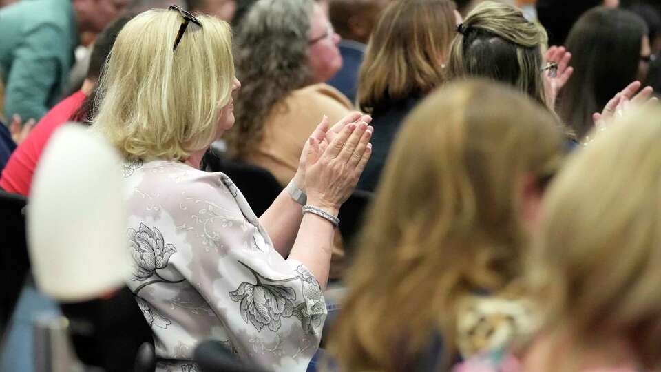 People applaud after a speaker during public comments about employing chaplains at the Katy ISD school board meeting at Katy ISD Educational Support Building on Monday, Feb. 26, 2024, in Katy.
