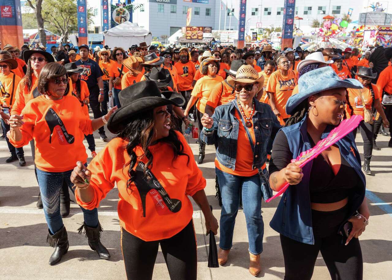 Women line dance during the Houston Livestock Show and Rodeo at NRG Park on Friday, March 1, 2024, in Houston.