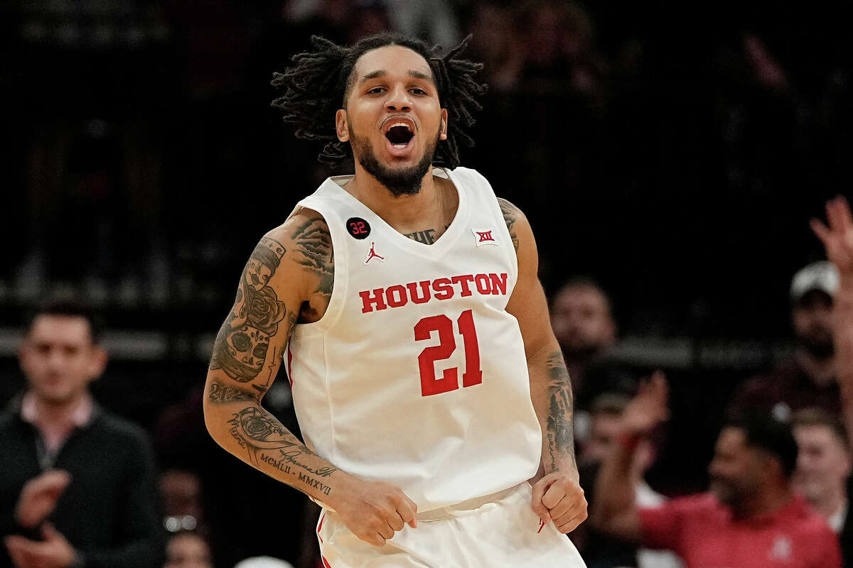 Houston guard Emanuel Sharp celebrates after a three pointer during the second half of an NCAA college basketball game against Texas A&M, Saturday, Dec. 16, 2023, in Houston.