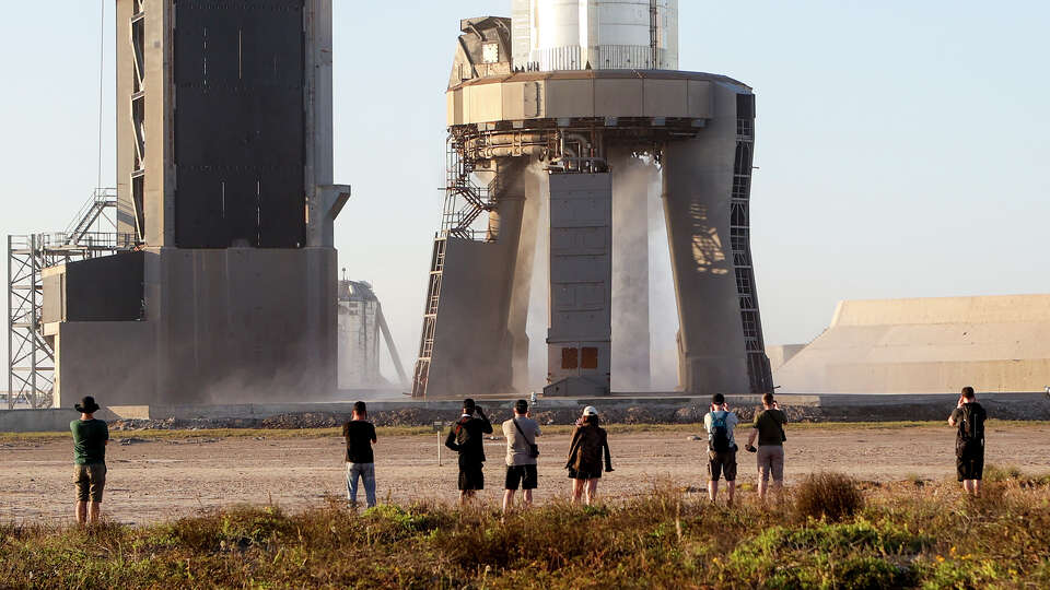 People watch a test of a fire suppression system on the launch pad at SpaceX's Starbase near Boca Chica ahead of a launch attempt in November.