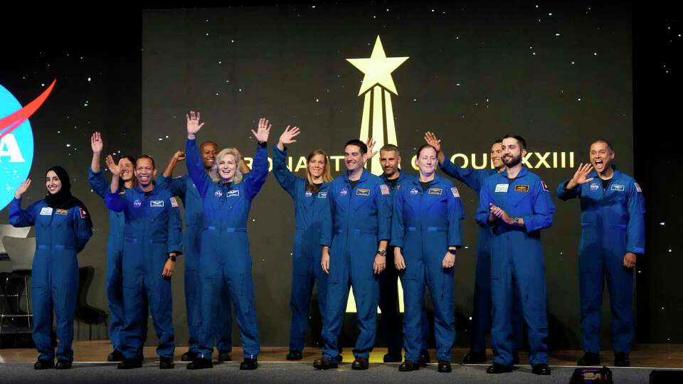 NASA's Astronaut Group XXIII graduate astronauts wave to the crowd when they are introduced at the graduation ceremony Tuesday, March 5, 2024 at Johnson Space Center in Houston.