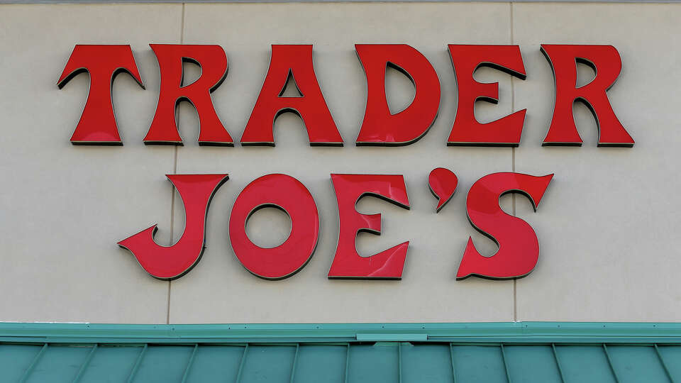 PINECREST, FL - OCTOBER 18: The Trader Joe's sign is seen during the grand opening of a Trader Joe's on October 18, 2013 in Pinecrest, Florida. Trader Joe's opened its first store in South Florida where shoppers can now take advantage of the California grocery chains low-cost wines and unique items not found in other stores. About 80 percent of what they sell is under the Trader Joe's private label. (Photo by Joe Raedle/Getty Images)