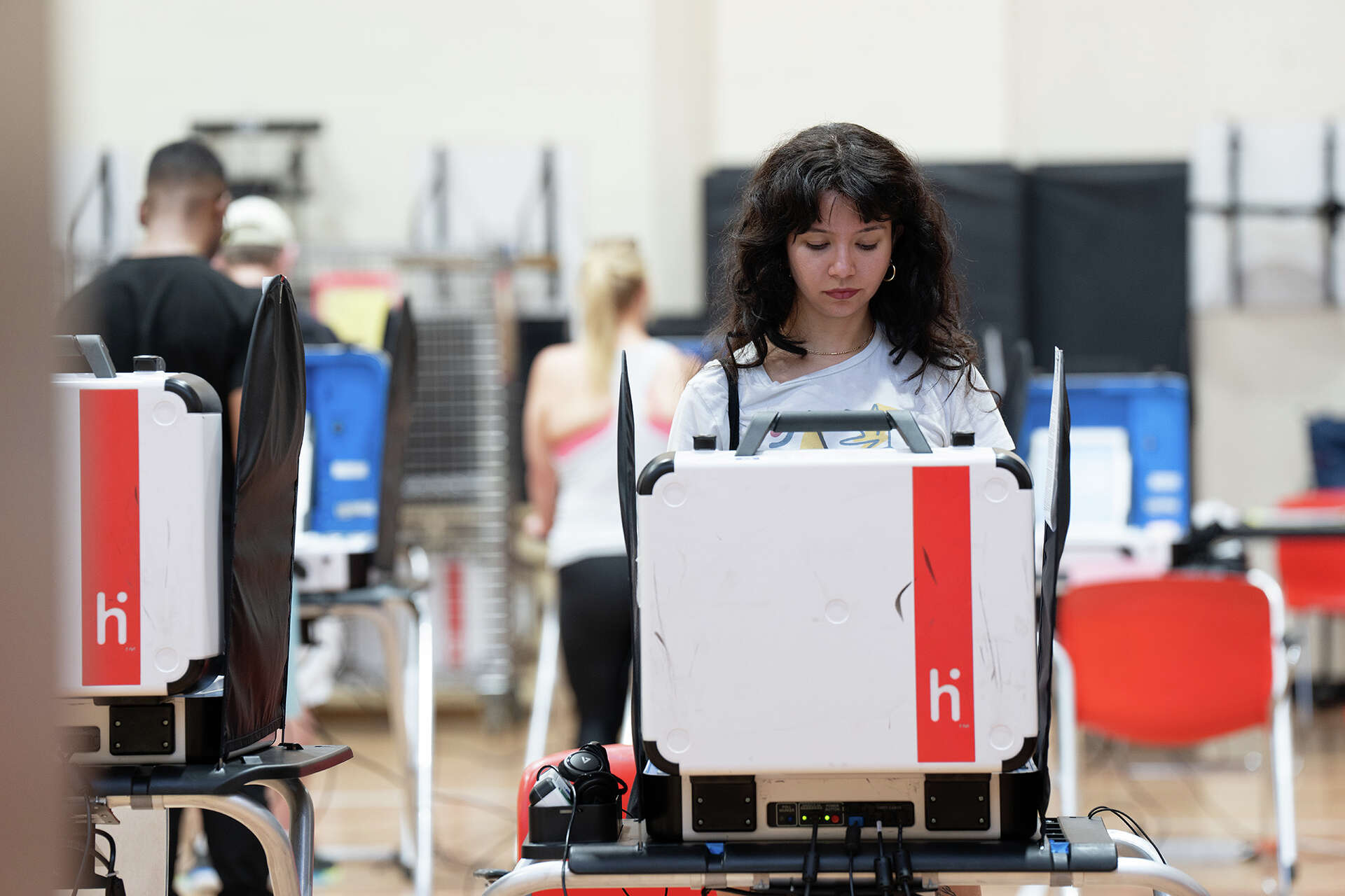A voter casts a ballot at West Gray Multi-Service Center on Tuesday, March 5, 2024 in Houston, TX.