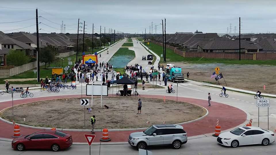 Fort Bend residents celebrate the completion of a new traffic circle and lane expansion at South Mason Road and Beechnut.