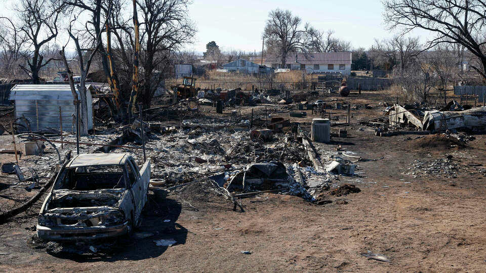 A truck and house destroyed by the Smokehouse Creek Fire are seen on Friday, March 1, 2024, in Stinnett, Texas. The wildfire has become the largest in state history at over 1 million acres. (Elías Valverde II/The Dallas Morning News/TNS)