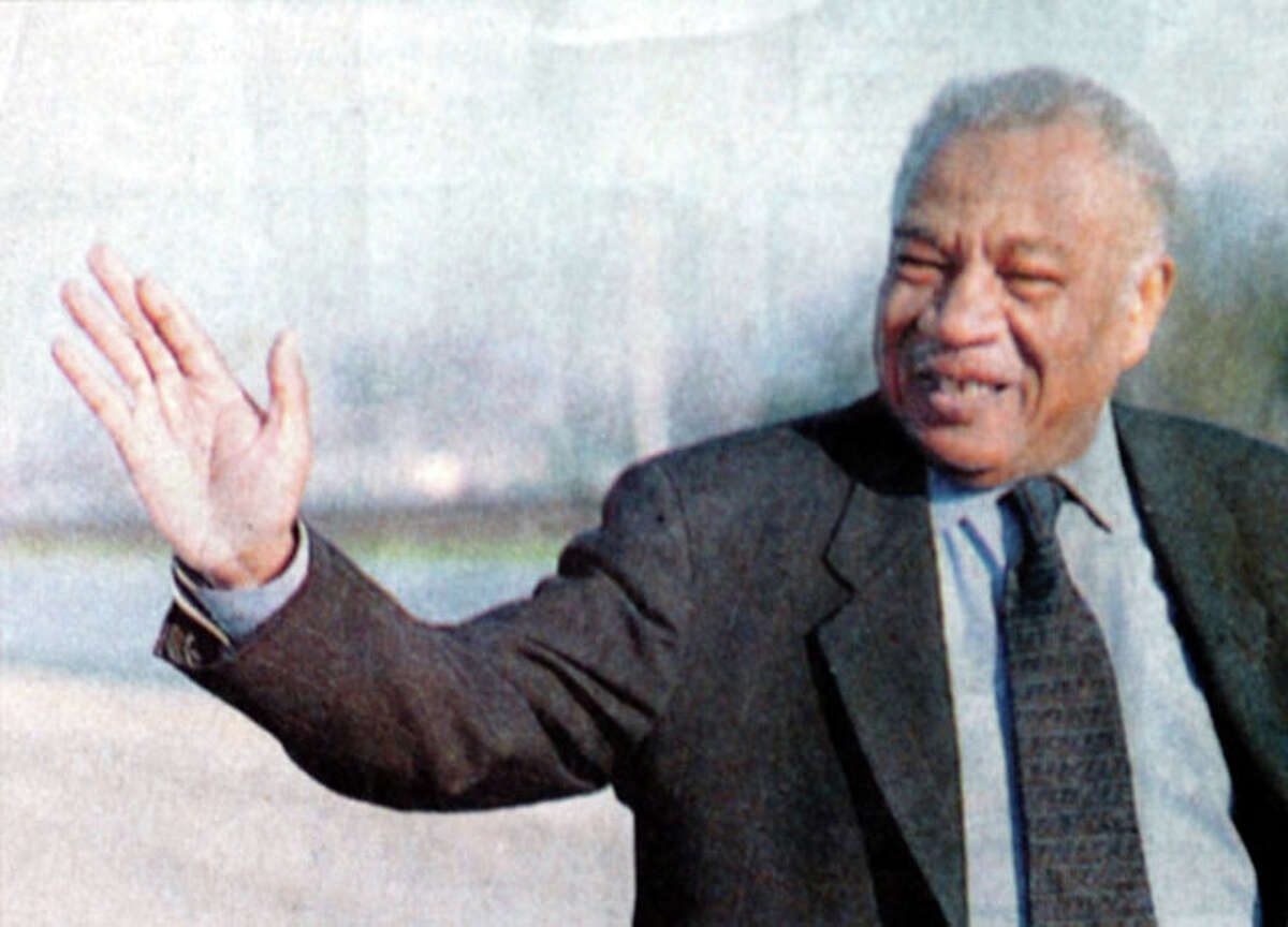 Theodore Johns, Sr. waves to the crowd as Grand Marshall of the Martin Luther King, Jr. parade in Beaumont in 1999. Enterprise file photo