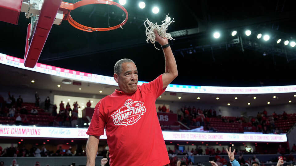 Houston coach Kelvin Sampson cuts down the net after an NCAA college basketball game against Kansas Saturday, March 9, 2024, in Houston. Houston won 76-46 and finished the regular season as the Big 12 Conference Champions. (AP Photo/David J. Phillip)