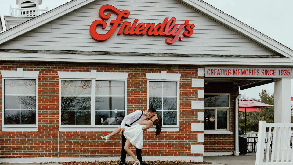 Michelle Fleming and Michael Ford pose for their engagement photos on Jan. 6, 2024, at a North Haven Friendly's.