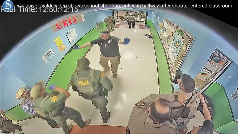 In this photo from surveillance video provided by the Uvalde Consolidated Independent School District via the Austin American-Statesman, authorities respond to the shooting at Robb Elementary School in Uvalde, Texas, Tuesday, May 24, 2022. (Uvalde Consolidated Independent School District/Austin American-Statesman via AP)