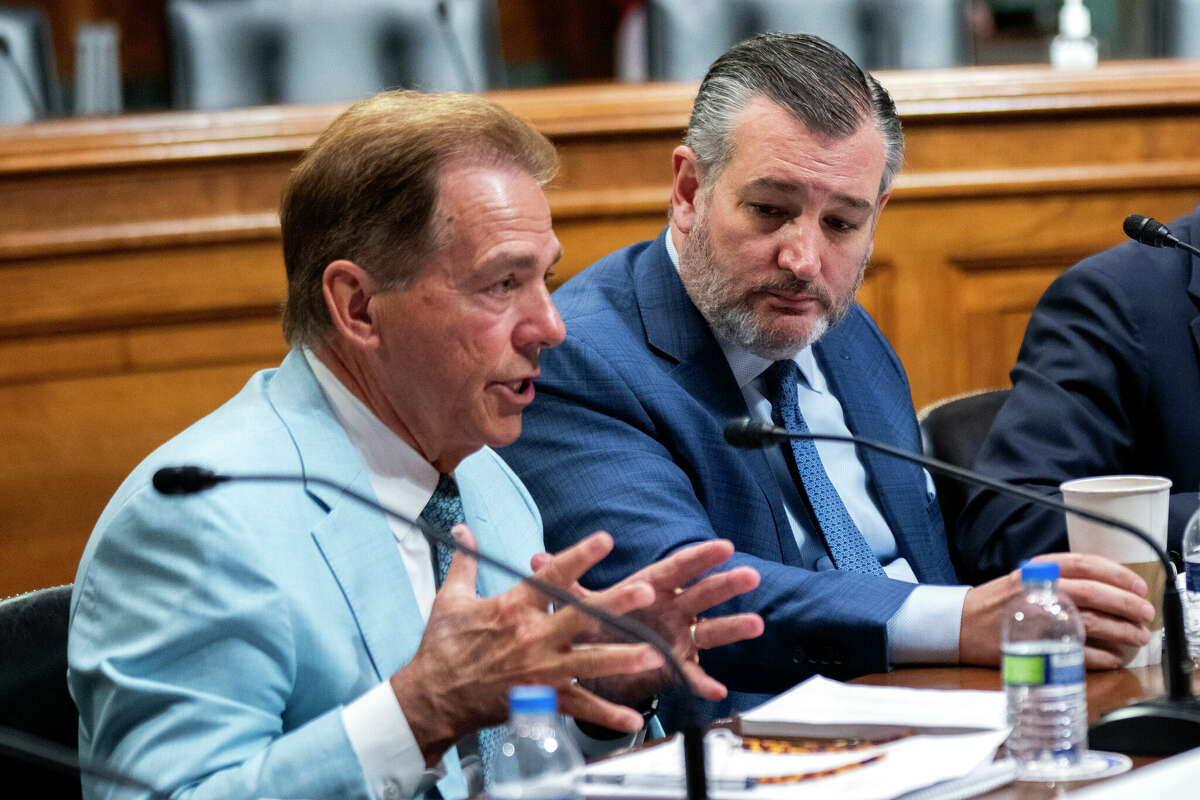 Former University of Alabama Head Football Coach Nick Saban, from left, speaks as Sen. Ted Cruz, R-Texas, listens during a roundtable on the future of college athletics and the need to codify name, image and likeness rights for student athletes, on Capitol Hill, Tuesday, March 12, 2024, in Washington.