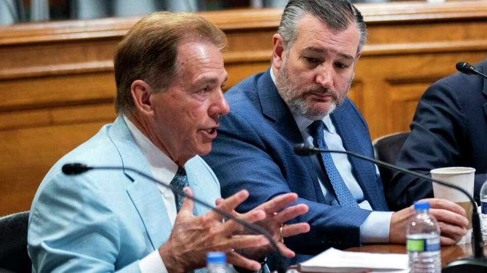 Former University of Alabama Head Football Coach Nick Saban, from left, speaks as Sen. Ted Cruz, R-Texas, listens during a roundtable on the future of college athletics and the need to codify name, image and likeness rights for student athletes, on Capitol Hill, Tuesday, March 12, 2024, in Washington. (AP Photo/Manuel Balce Ceneta)