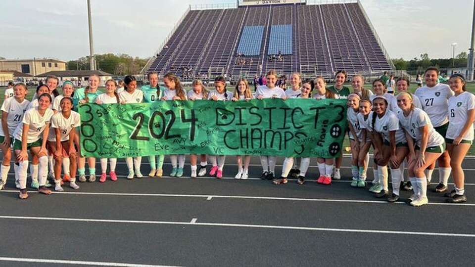 Kingwood Park girls celebrate an undefeated district title against Dayton at Broncos field. The win was the program's 300th career win.