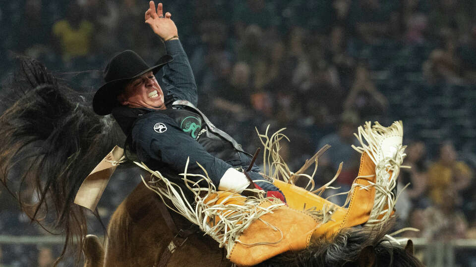 Richie Champion rides Organic Outlaw while competing in bareback riding during the Super Series V, Round 3 of the Rodeo Houston at the Houston Livestock Show and Rodeo at NRG Park, Tuesday, March 12, 2024, in Houston.