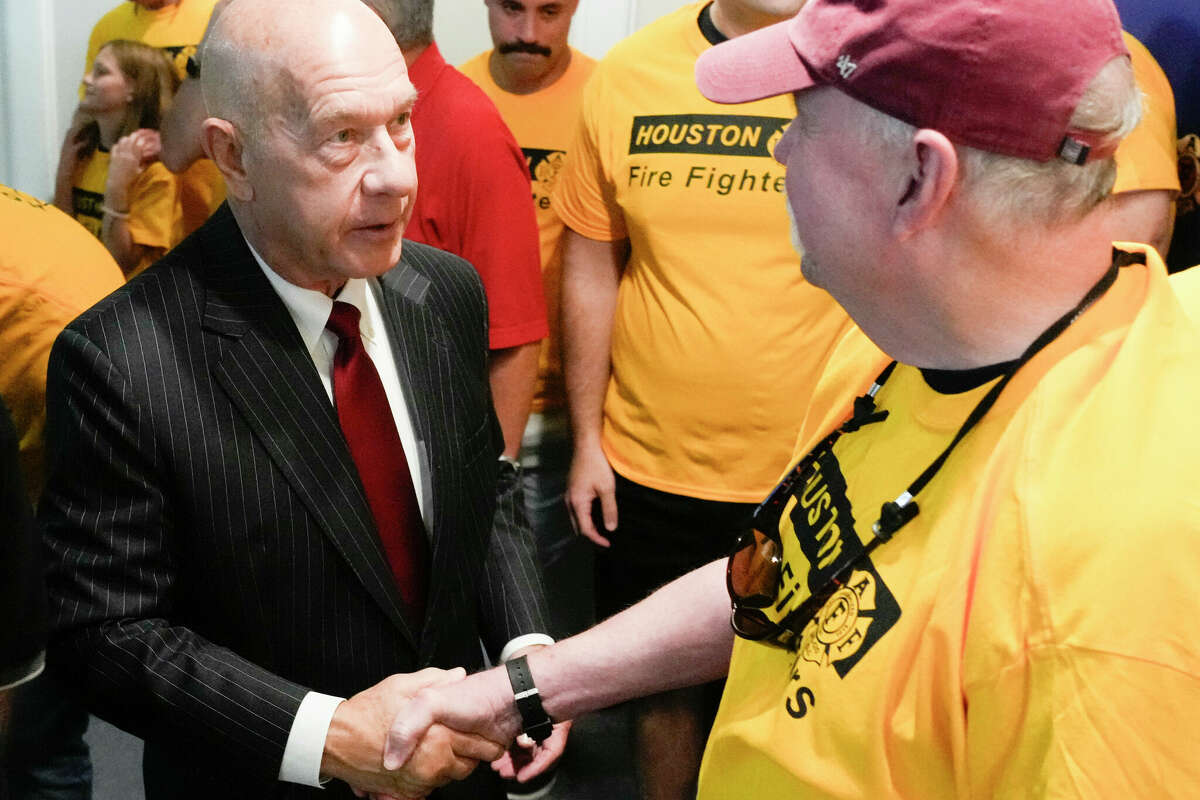 HOUSTON, TEXAS - SEPTEMBER 29: John Whitmire, left, visits with firefighters as the Houston Professional Fire Fighters Association announced its endorsement of him for the Houston mayoral race at UPFFA Union Hall, Saturday, Sept. 29, 2023, in Houston. (Jason Fochtman/Houston Chronicle via Getty Images)