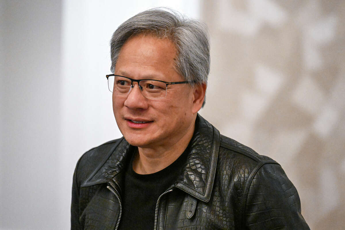 Jensen Huang, co-founder and chief executive officer of Nvidia, speaks during a media roundtable in Kuala Lumpur on December 8, 2023. Huang's net worth has skyrocketed with excitement about artificial intelligence technology.