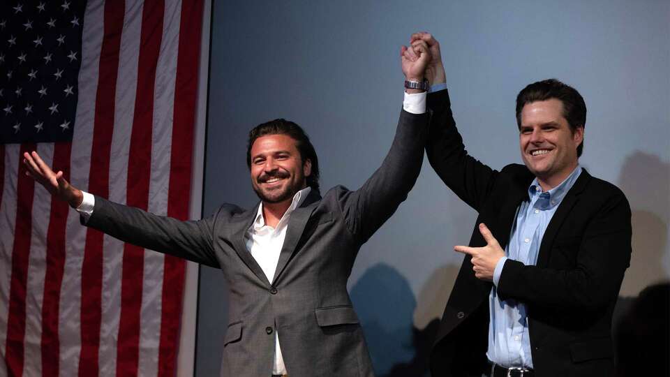 Florida Congressman, Matt Gaetz raises Brandon Herraras hand after both speak at a rally for Herrara at the Angry Elephant. Herrara was campaigning with Matt Gaetz ahead of his runoff against US Rep Tony Gonzales.