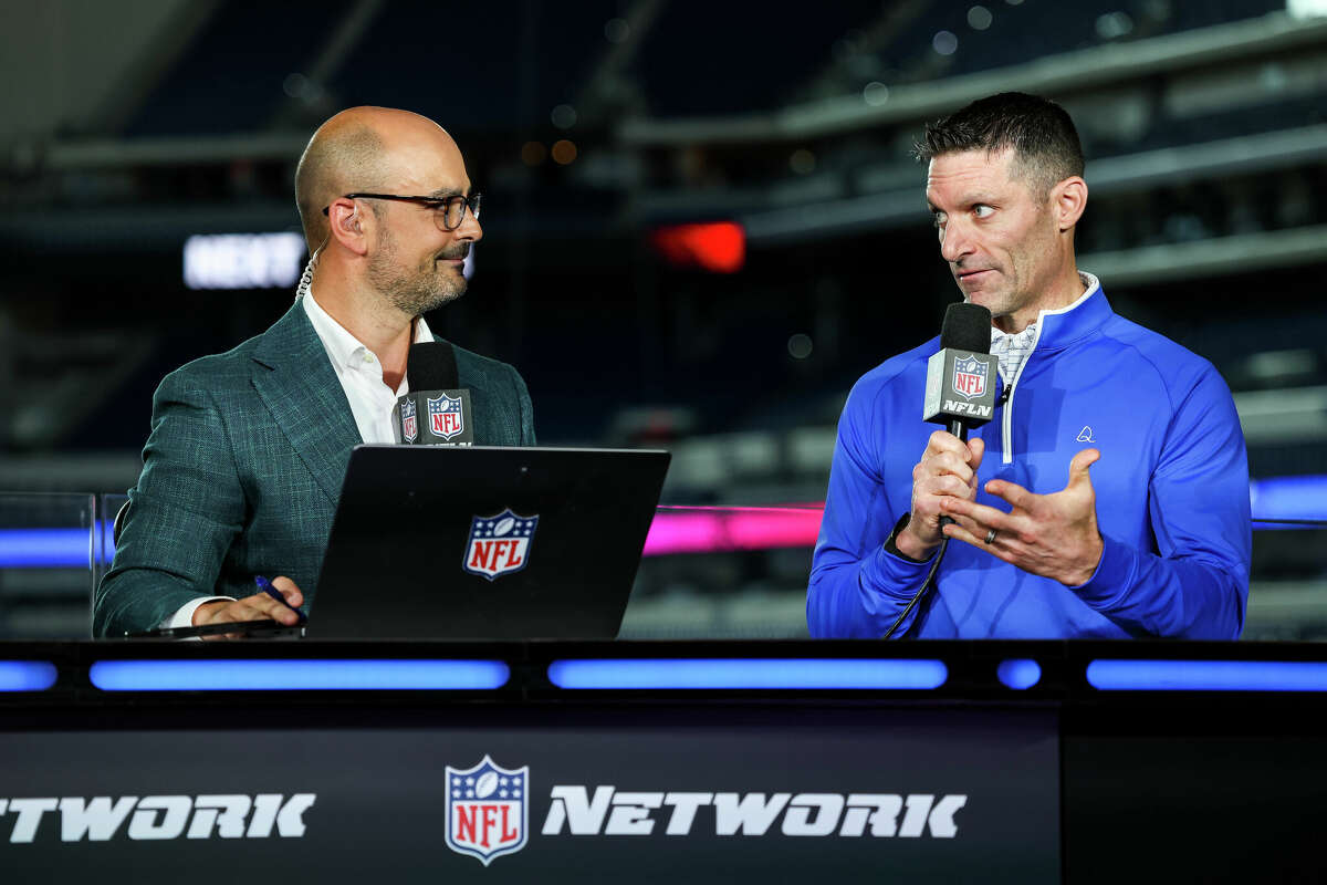 NFL Network host Mike Garafolo and General Manager Nick Caserio of the Houston Texans interact on set of The Insiders at Lucas Oil Stadium on February 28, 2024 in Indianapolis, Indiana.