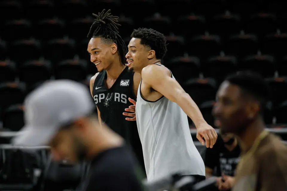 San Antonio Spurs guard Devin Vassell and forward Keldon Johnson joke around as they participate in a shoot-around at Moody Center in Austin, Texas, on Friday morning, March 15, 2024, to prepare for their I-35 series game against the Denver Nuggets.
