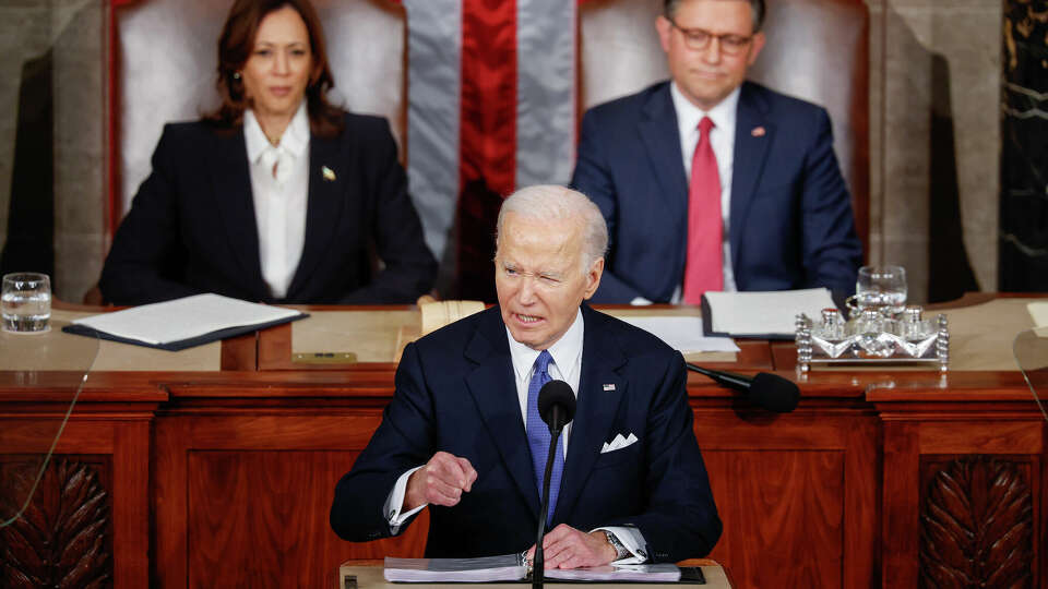 President Joe Biden delivers the State of the Union address during a joint meeting of Congress in the House chamber at the U.S. Capitol on Thursday, March 7, 2024, in Washington, D.C. Biden is joined by Vice President Kamala Harris and Speaker of the House Mike Johnson (R-LA). (Chip Somodevilla/Getty Images/TNS)