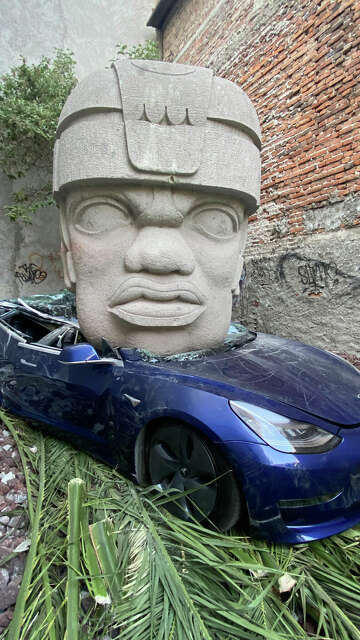 Mexican artist destroys a Tesla with 9-ton Olmec head