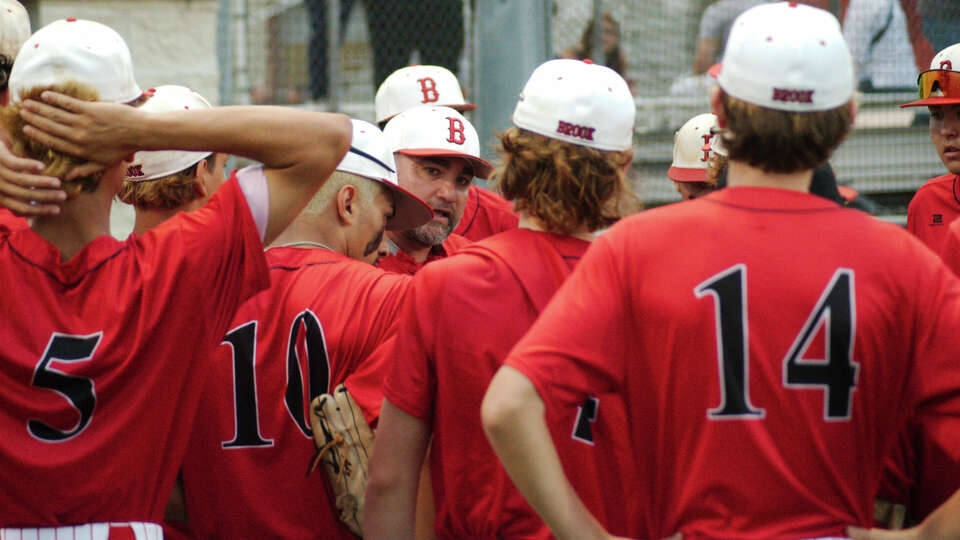 Clear Brook baseball coach Gene Flores speaks to his team between innings against Strake Jesuit at a 6A bi-district baseball playoff game Thursday, May 4, 2023 at Clear Brook High School.