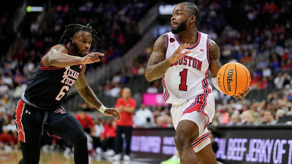 Jamal Shead #1 of the Houston Cougars goes to the basket against Joe Toussaint #6 of the Texas Tech Red Raiders during the first half of a semifinal game of the Big 12 Men's Basketball Tournament at T-Mobile Center on March 15, 2024 in Kansas City, Missouri. (Photo by Jay Biggerstaff/Getty Images)