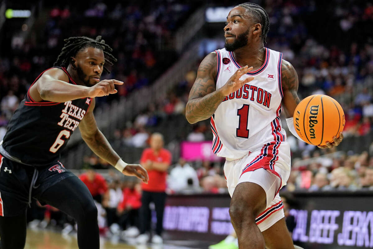 Jamal Shead #1 of the Houston Cougars goes to the basket against Joe Toussaint #6 of the Texas Tech Red Raiders during the first half of a semifinal game of the Big 12 Men's Basketball Tournament at T-Mobile Center on March 15, 2024 in Kansas City, Missouri. (Photo by Jay Biggerstaff/Getty Images)