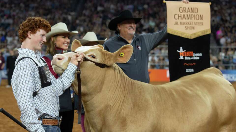 Blaize Benson reacts after his steer was named grand champion during the Junior Market Steer Selection at the Houston Livestock Show and Rodeo at NRG Stadium, Friday, March 15, 2024, in Houston.