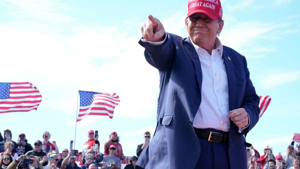 Republican presidential candidate former President Donald Trump gestures to the crowd at a campaign rally Saturday, March 16, 2024, in Vandalia, Ohio.