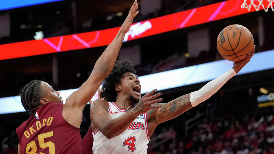 Houston Rockets' Jalen Green (4) goes up for a shot as Cleveland Cavaliers' Isaac Okoro (35) defends during the second half of an NBA basketball game Saturday, March 16, 2024, in Houston. The Rockets won 117-103. (AP Photo/David J. Phillip)