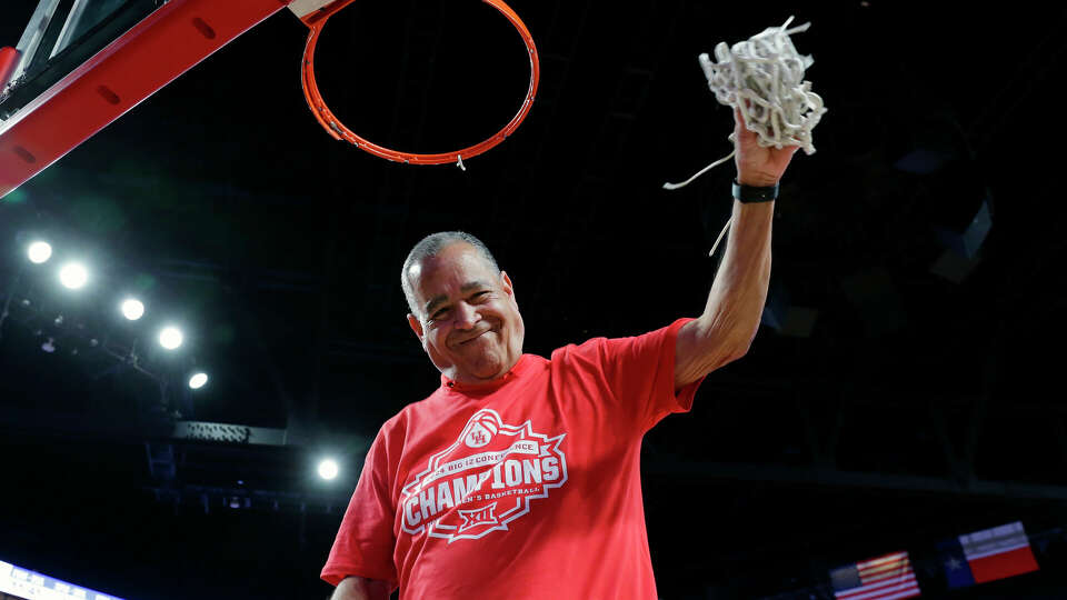 Houston head coach Kelvin Sampson cuts down the net after clinching the Big 12 Championship after their 76-46 win over Kansas after their game held at the Fertitta Center Saturday, Mar. 9, 2024 in Houston.