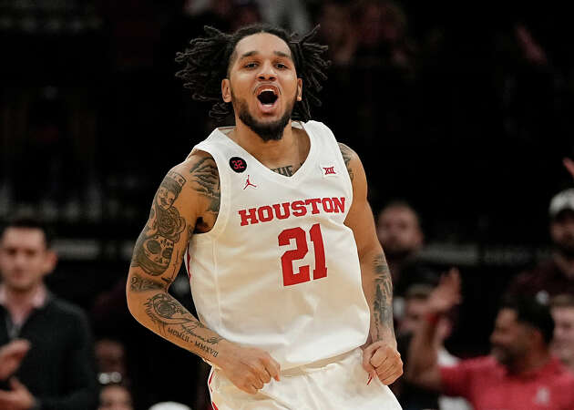 Houston guard Emanuel Sharp celebrates after a three pointer during the second half of an NCAA college basketball game against Texas A&M, Saturday, Dec. 16, 2023, in Houston.