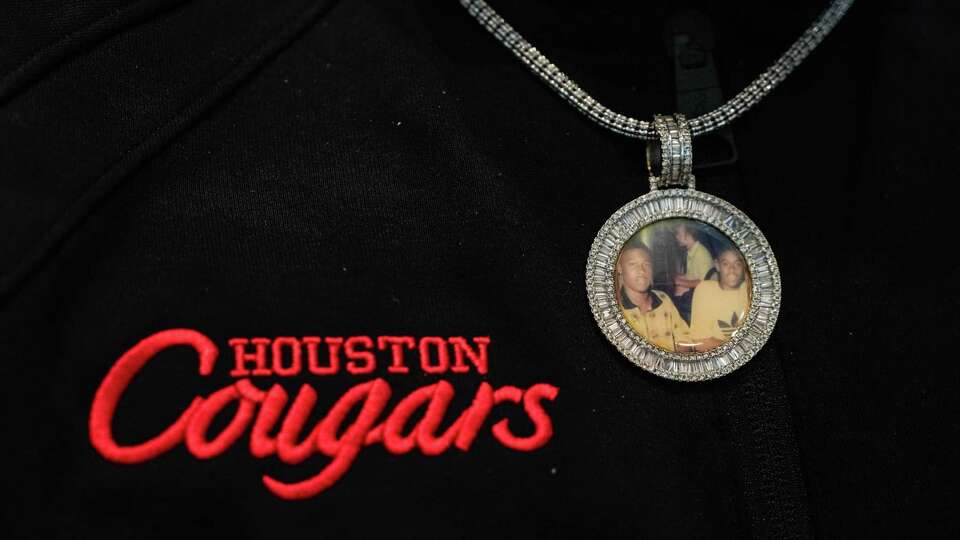 UH basketball forward J'Wan Roberts wears a pendant of his father and uncle while watching the NCAA Tournament Selection Show on CBS at the Post Oak Hotel on Sunday, March 17, 2024, in Houston.