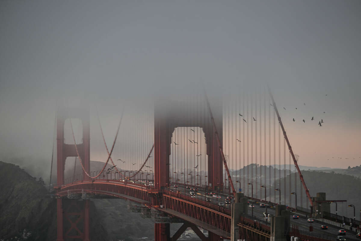 San Francisco's iconic fog blankets the Golden Gate Bridge during sunset as seen from Marin Headlands of Sausalito on October 17, 2023. Fog is expected to return to the forecast by tomorrow, with rain coming later this week. 