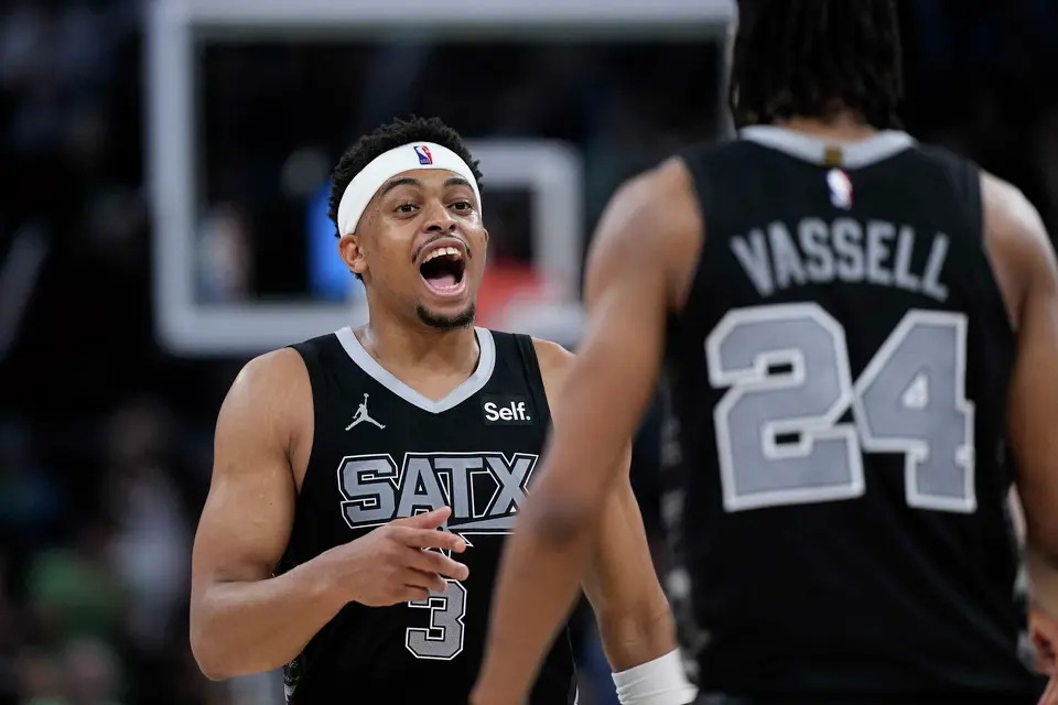 San Antonio Spurs forward Keldon Johnson (3) and guard Devin Vassell (24) celebrate after their overtime win over the Brooklyn Nets in an NBA basketball game in Austin, Texas, Sunday, March 17, 2024. (AP Photo/Eric Gay)