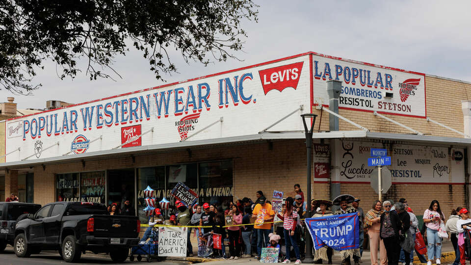 People line up along Main Street in downtown Eagle Pass, Texas, hoping to catch a glimpse of former president Donald Trump as he arrives to Shelby Park on Thursday, Feb. 29, 2024. The park is currently the epicenter of an immigration enforcement battle between Texas officials and the federal government.