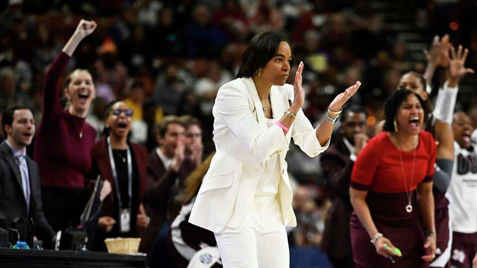 GREENVILLE, SOUTH CAROLINA - MARCH 08: Head coach Joni Taylor of the Texas A&M Aggies celebrates against the South Carolina Gamecocks in the third quarter during the quarterfinals of the SEC Women's Basketball Tournament at Bon Secours Wellness Arena on March 08, 2024 in Greenville, South Carolina.