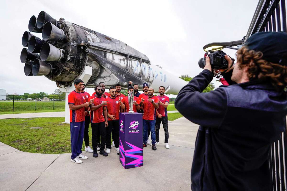 Members of the USA Cricket Team get their photos taken with the World Cup trophy with the Falcon 9 in the background during a tour of Space Center Houston on Thursday, March 21, 2024, in Houston. The International Cricket Council is conducting an ICC Men's T20 World Cup Trophy Tour ahead of June's 2024 World Cup, which takes place in the US and the West Indies. The trophy's visit to Space Center Houston, is a play on the Men's T20 World Cup mantra, 'Out of this World.'