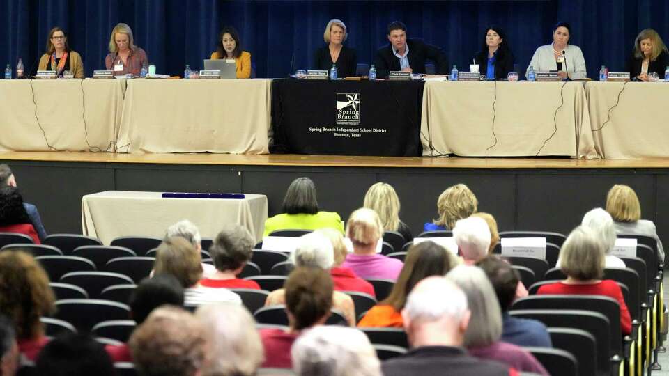 Spring Branch ISD's board president Chris Earnest speaks with the rest of the board during public comments as Spring Branch trustees considered a proposal to remove former Spring Branch ISD Superintendent Duncan Klussmann's name from the district's educational center, after he wrote a critical op-ed about the district's recent $35M in budget cuts during a board meeting at Duncan F. Klussmann Education Center on Monday, March 25, 2024, in Houston.