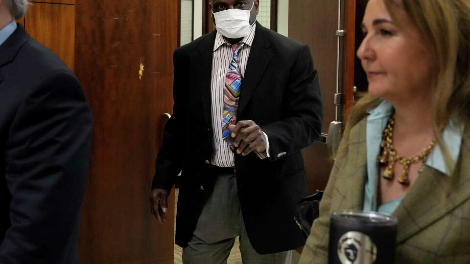 Retired Houston Police Department officer Gerald Goines leaves the court after the Judge Veronica M. Nelson of 482nd District Court quashed two felony murder indictments against him Tuesday, March 26, 2024 at Harris County Criminal Courts at Law in Houston.