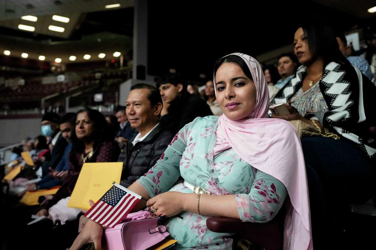 Fatima Jouhari waits to receive her naturalization certificate after the ceremony Wednesday, March 27, 2024 at M.O. Campbell Educational Center in Houston. Jouhari, originally from Morocco, was among more than 1300 Houston-area residents became naturalized citizens Wednesday.