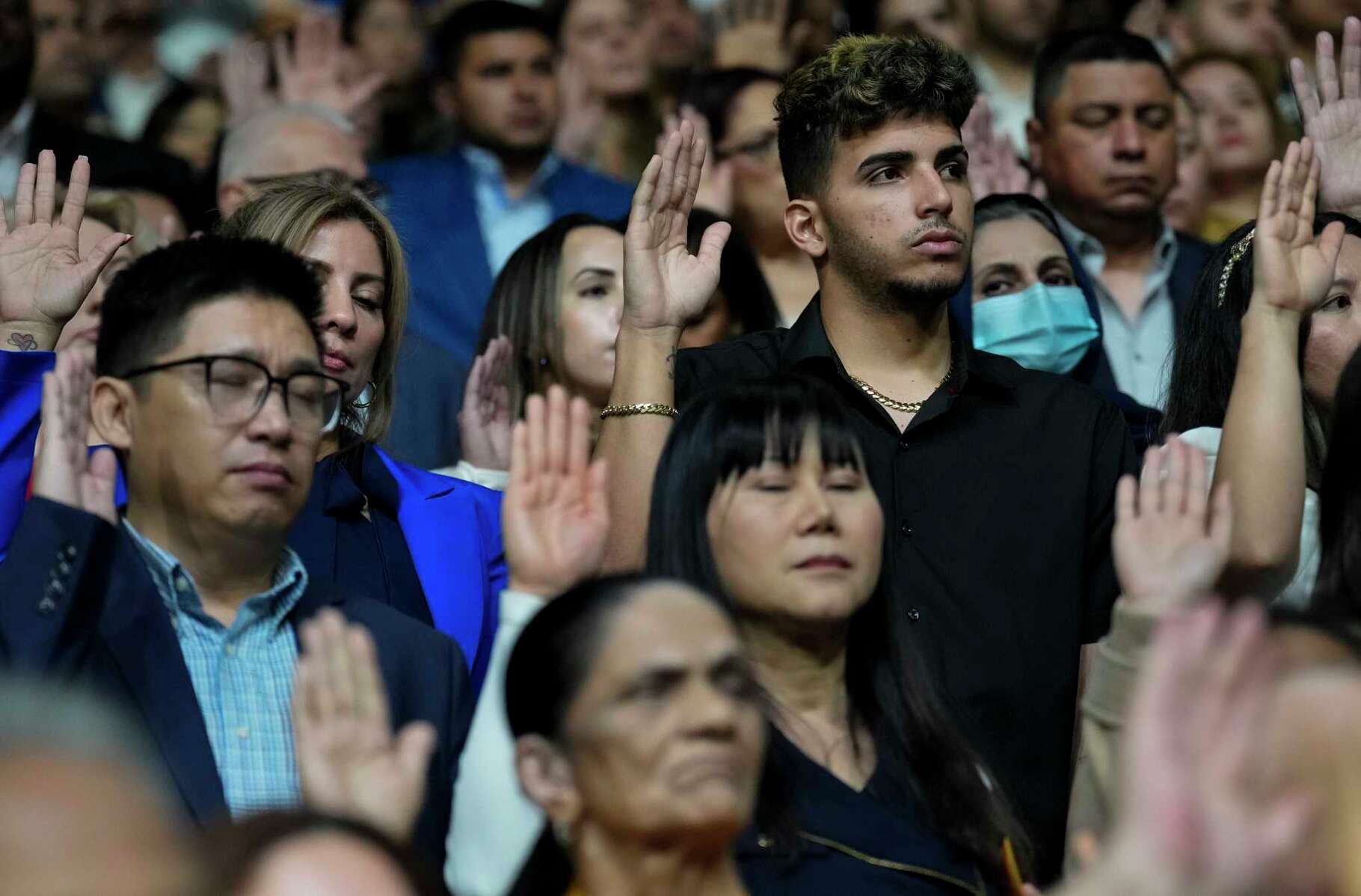 More than 1300 Houston-area residents taking oath to naturalized as American citizens during a ceremony Wednesday, March 27, 2024 at M.O. Campbell Educational Center in Houston.