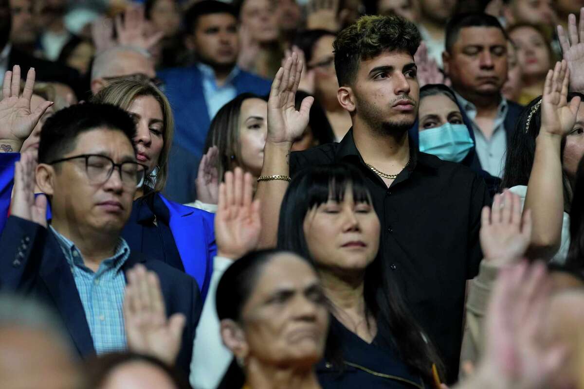 More than 1300 Houston-area residents taking oath to naturalized as American citizens during a ceremony Wednesday, March 27, 2024 at M.O. Campbell Educational Center in Houston.