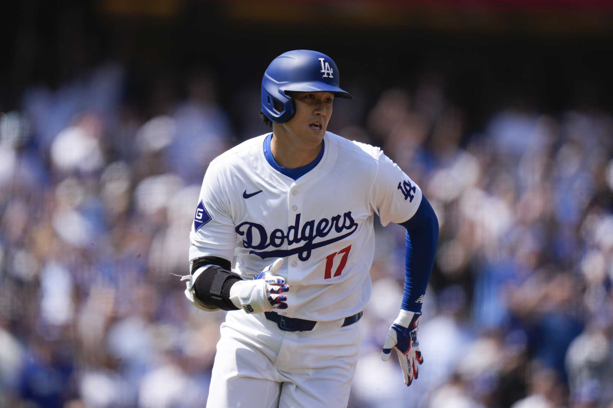 Shohei Ohtani reaches 3 times in home debut as the Dodgers rout the Cardinals 7-1