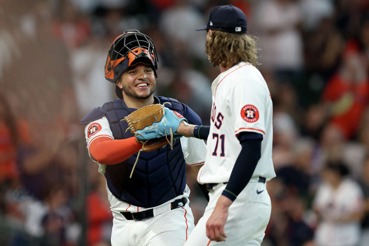 HOUSTON, TEXAS - MARCH 28: Yainer Diaz #21 of the Houston Astros congratulates Josh Hader #71 after the ninth inning against the New York Yankees during Opening Day at Minute Maid Park on March 28, 2024 in Houston, Texas. (Photo by Tim Warner/Getty Images)