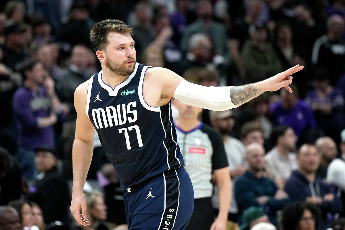 Luka Doncic #77 of the Dallas Mavericks reacts after making a foul shot to give the Mavericks a 4 point lead over the Sacramento Kings with 4.1 seconds remaining in the game at Golden 1 Center on March 29, 2024 in Sacramento, California.