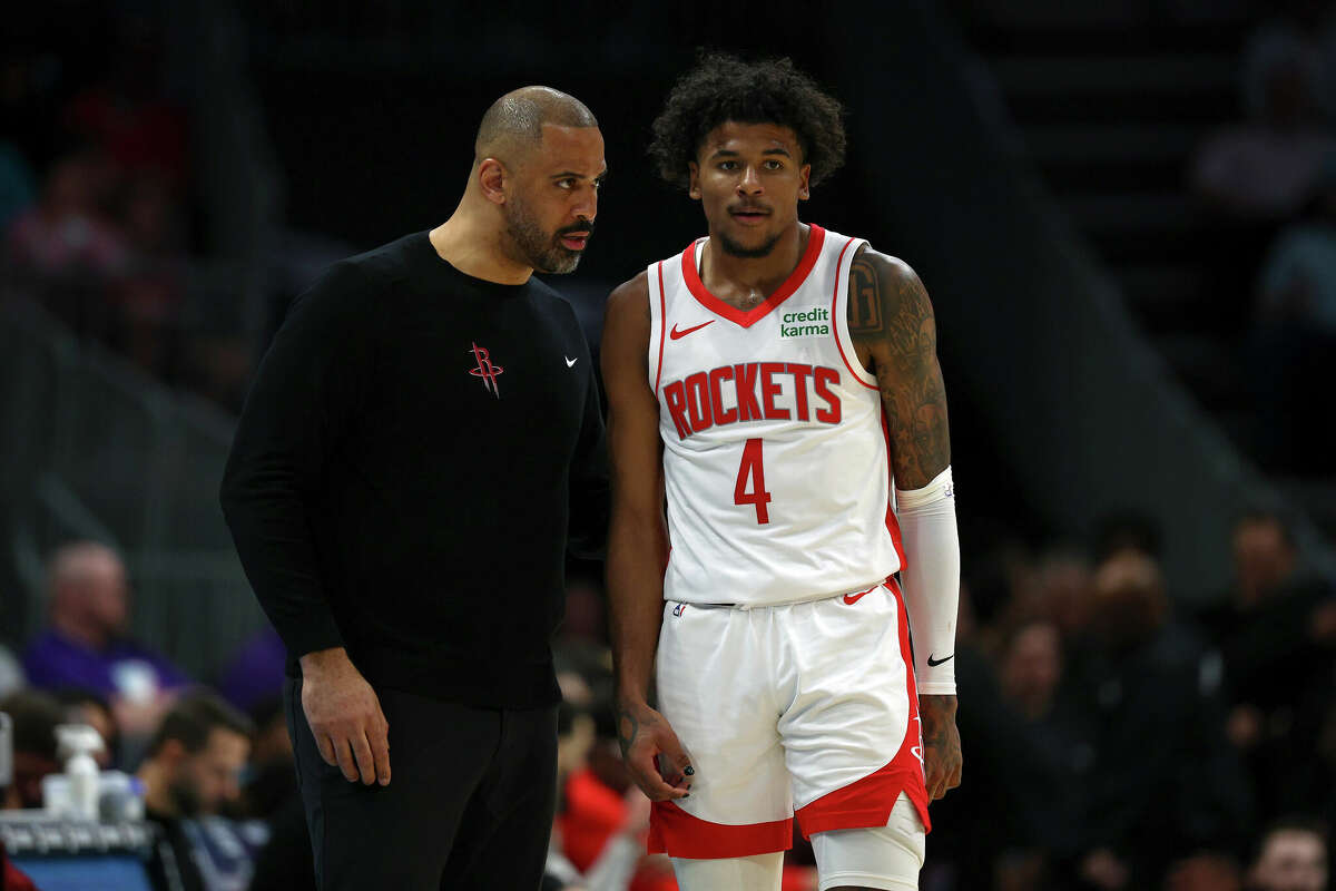 Houston Rockets head coach Ime Udoka speaks with Jalen Green #4 during the second half of the game against the Charlotte Hornets at Spectrum Center on January 26, 2024 in Charlotte, North Carolina.