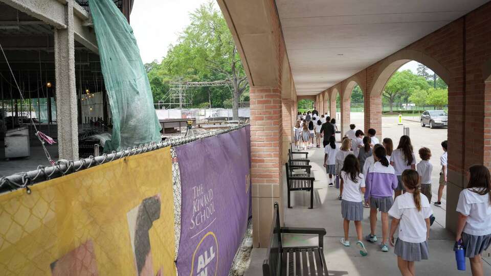 Children walk between classes as construction continues on a campus expansion Monday, April 1, 2024, at the Kinkaid School in Houston.